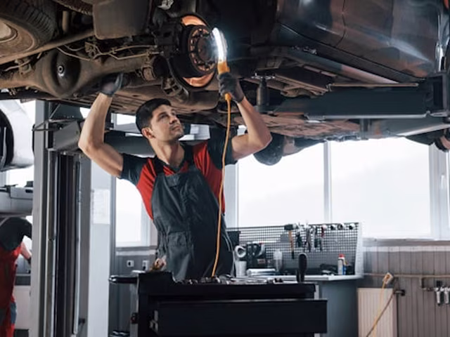 A vehicle on the hoist in one of the service bays at Central East Mechanical, Dapto