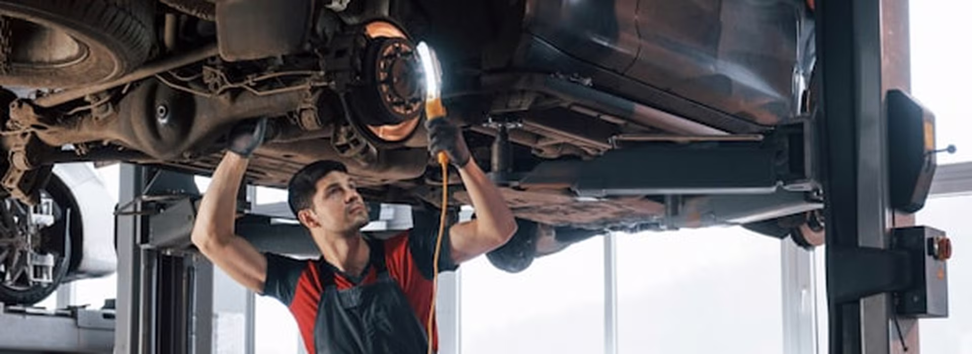 Front strut and coil spring assembly being replaced on a vehicle at Central East Mechanical in Dapto