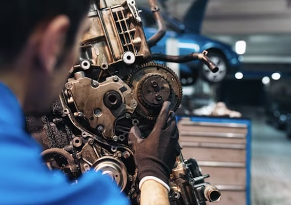 Gearbox lowered out of a manual vehicle during a clutch replacement at Central East Mechanical