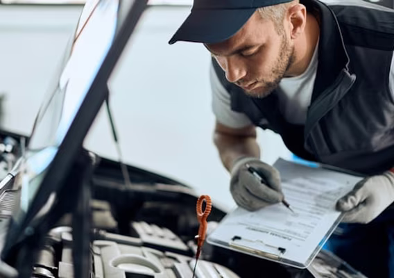 Mechanic checking headlight operation during a NSW eSafety pink slip inspection at Central East Mechanical
